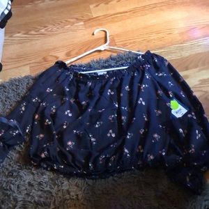 Navy blue floral bell top.